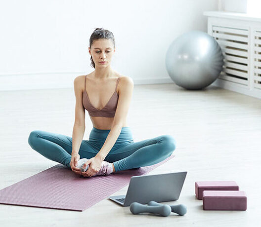 Young Woman Watching Online Workout